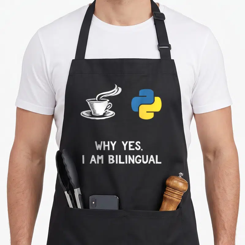 Python programming apron - White coffee cup and blue yellow python logo with bilingual text — shown on a black cotton canvas apron against a white background