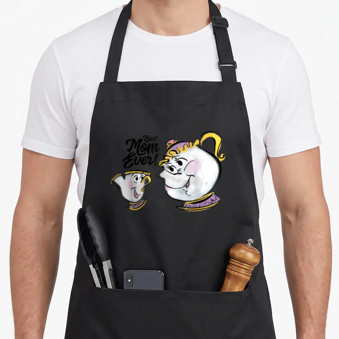 Chip mrs potts apron - Mrs Potts teapot and Chip cup with Best Mom Ever text in cartoon style — shown on a black cotton canvas apron against a white background