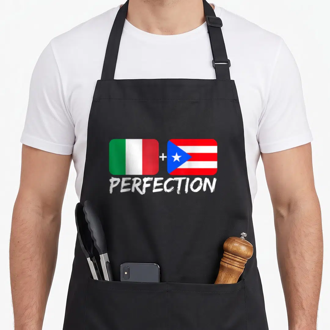 Puerto italian apron - Italian and Puerto Rican flags separated by a plus sign above the word PERFECTION — shown on a black cotton canvas apron against a white background