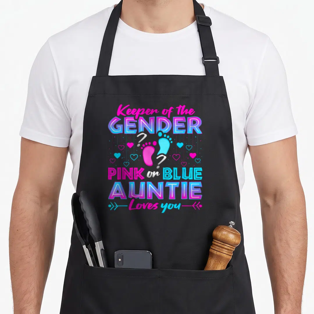 Keeper gender apron or apron - Stacked pink and blue text with two baby footprints and hearts on black bib — shown on a black cotton canvas apron against a white background
