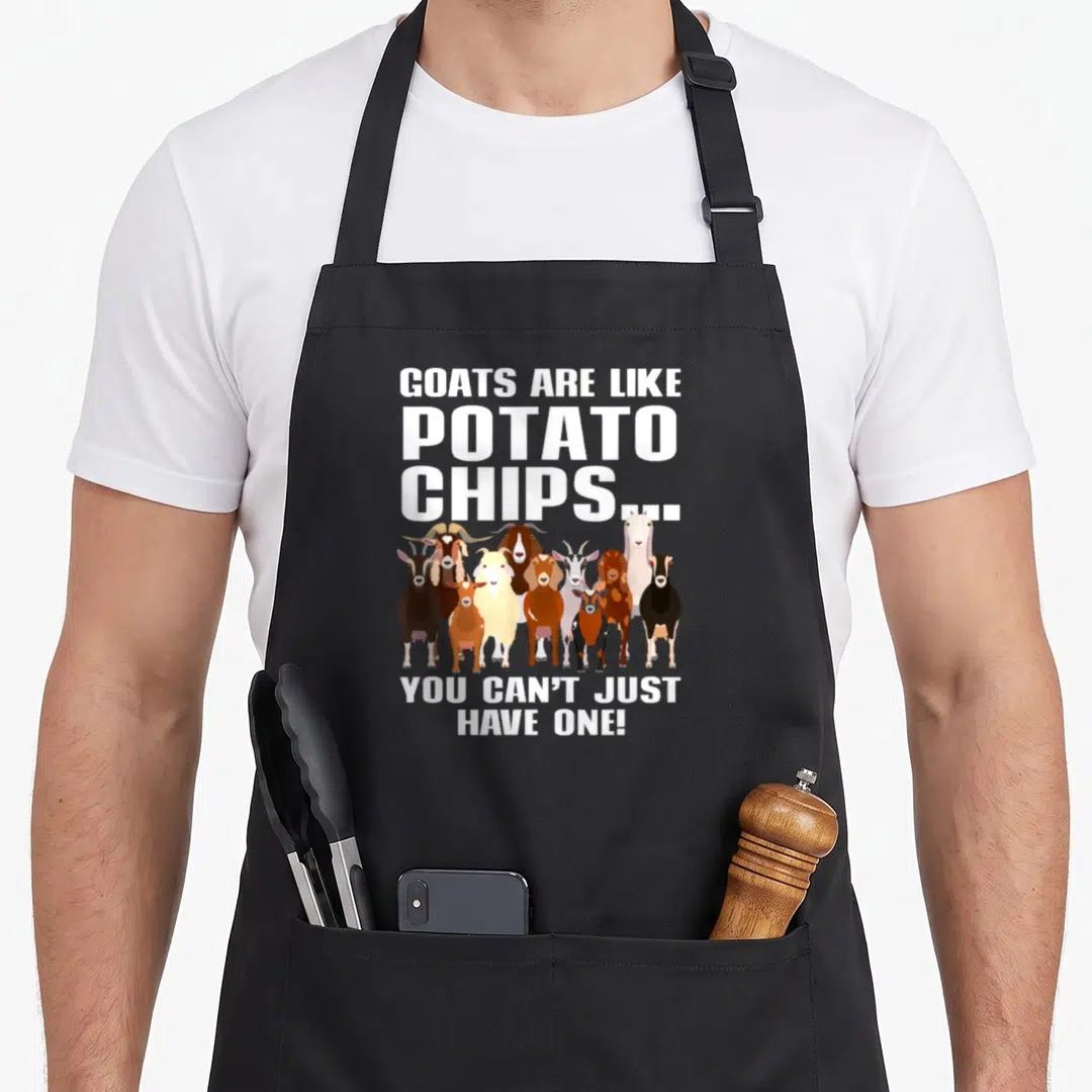 Potato farm apron - Ten cartoon goats standing in a row under white text reading goats are like potato chips you can't — shown on a black cotton canvas apron against a white background
