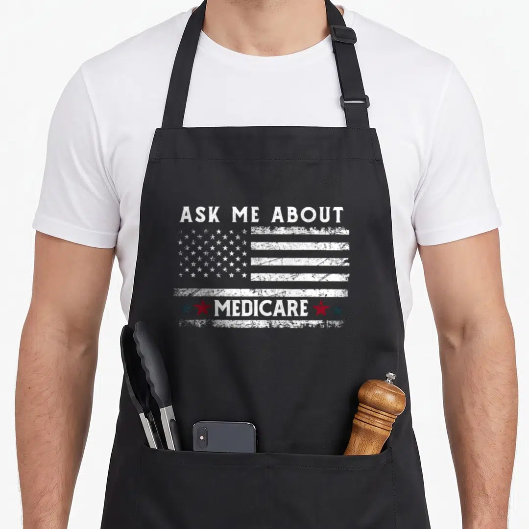 Ask health insurance agent healthcare medicare apron - Distressed USA flag with ASK ME ABOUT MEDICARE text and four — shown on a black cotton canvas apron against a white background