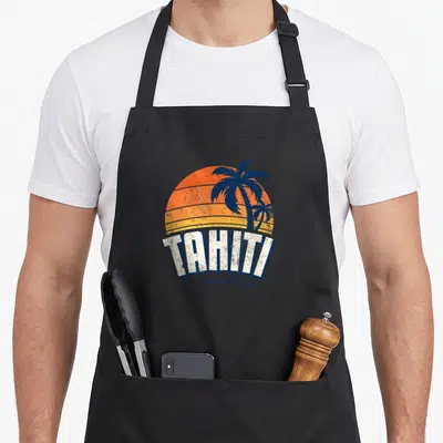 Agent h apron - Retro tahiti sunset with two blue palm trees and white block lettering — shown on a black cotton canvas apron against a white background