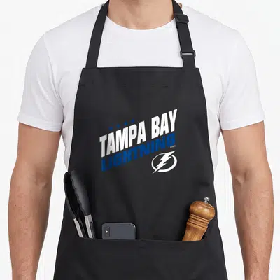 Tampa fuel apron - Slanted TAMPA BAY LIGHTNING text with five stars and lightning bolt logo — shown on a black cotton canvas apron against a white background
