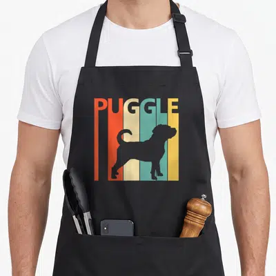 Funny puggle dog apron - Grey dog silhouette over five vertical stripes of orange, red, beige, teal, and yellow — shown on a black cotton canvas apron against a white background