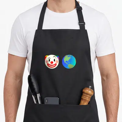 Honk clown aprons - Cartoon clown face beside a blue and green globe of the earth — shown on a black cotton canvas apron against a white background