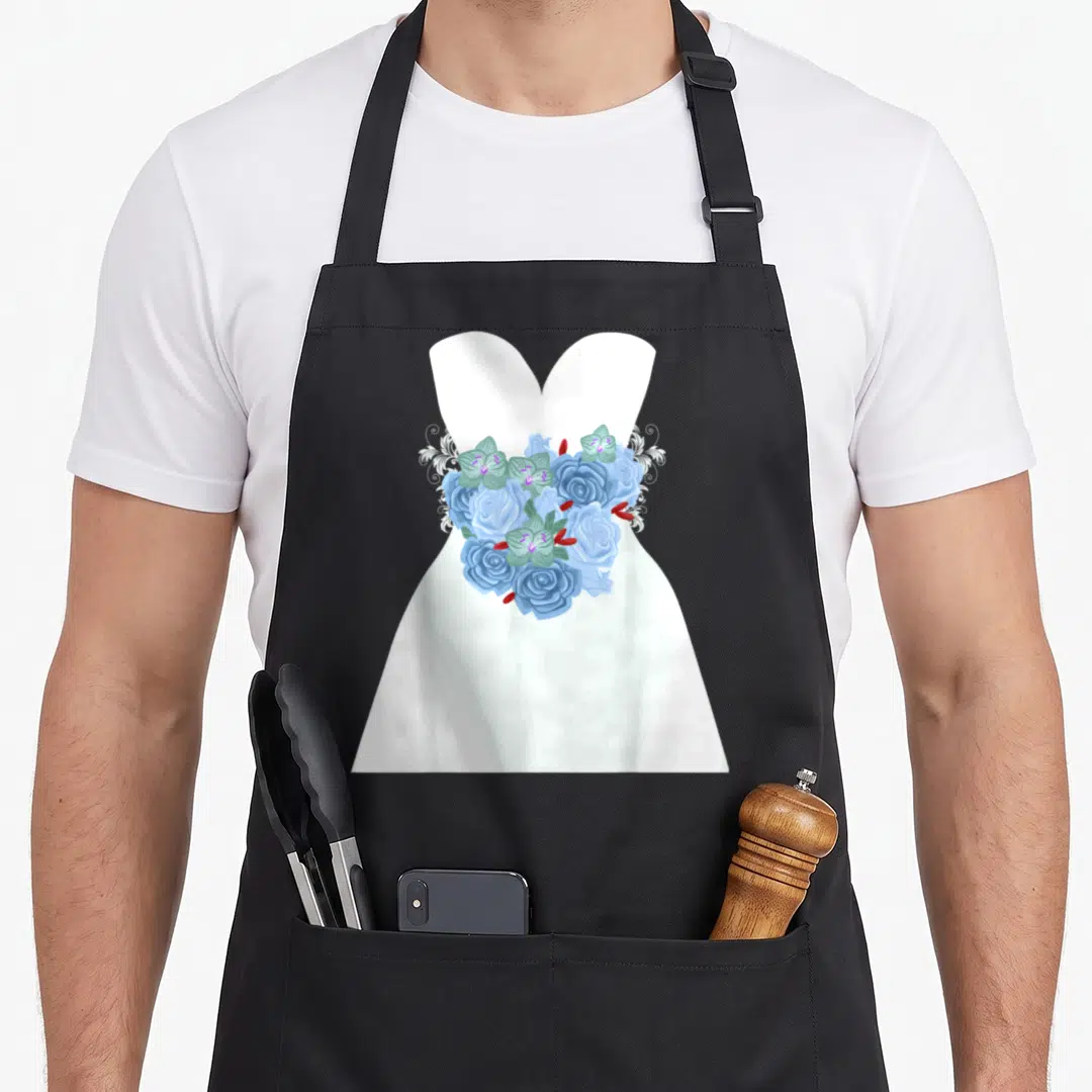 Simple wedding bridal apron - White dress graphic with blue roses, green leaves, and swirls at the waist — shown on a black cotton canvas apron against a white background