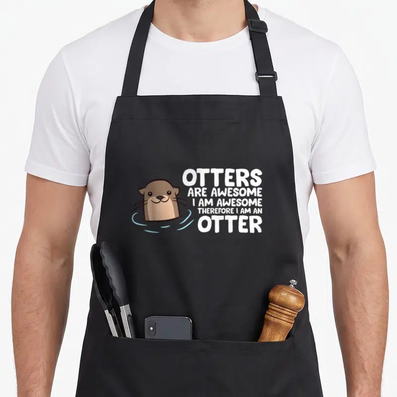 Otter therefore apron - Cartoon brown otter in blue water next to five lines of white text about being awesome — shown on a black cotton canvas apron against a white background