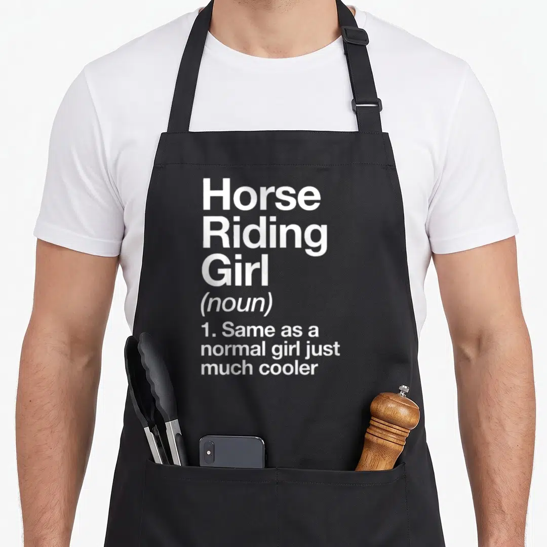 Sassy horse apron - White stacked text defining Horse Riding Girl as same as normal girl but cooler — shown on a black cotton canvas apron against a white background