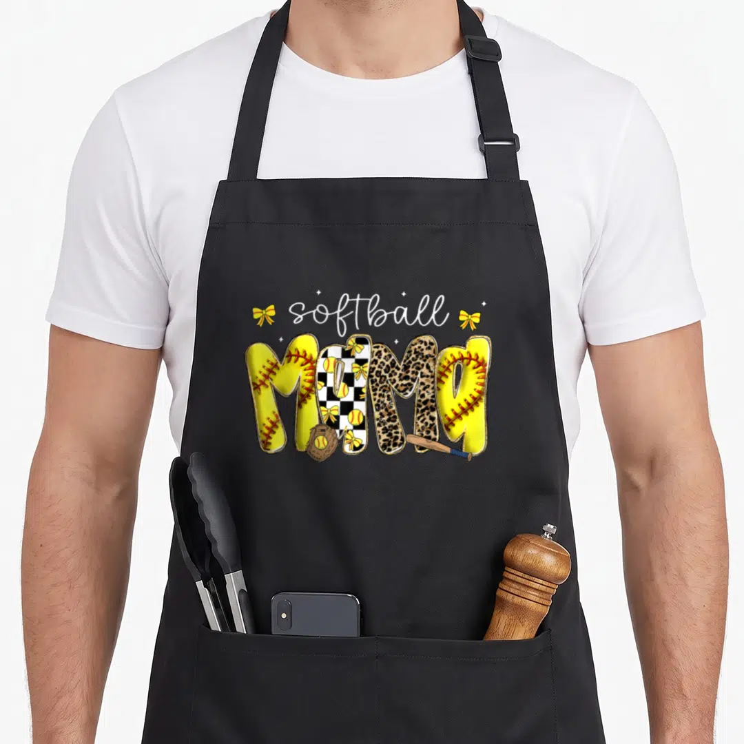 Leopard mother's apron - Softball MOMA text with yellow stitching, checkerboard, leopard print, glove, bat, and bows — shown on a black cotton canvas apron against a white background