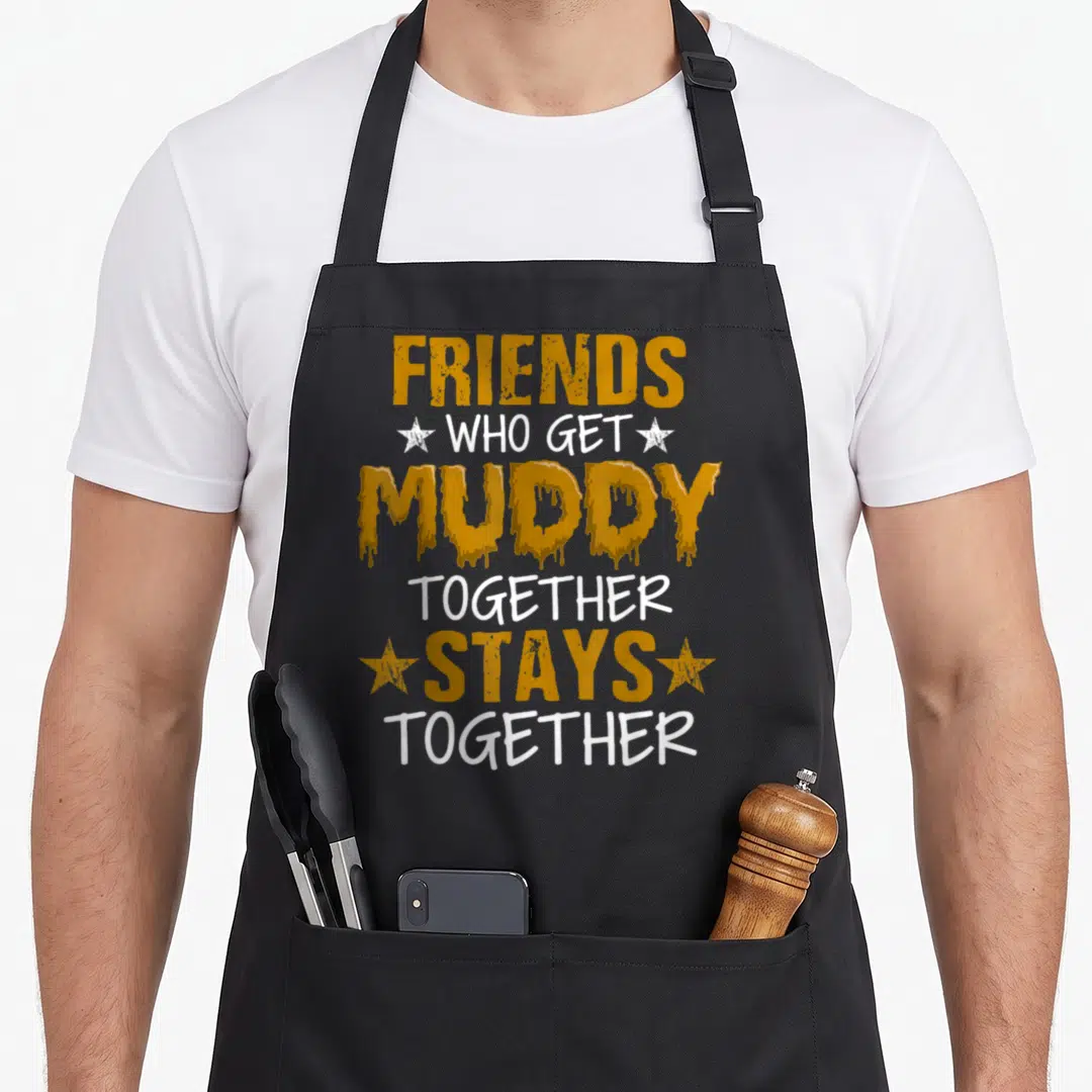 Atv princess apron - Gold dripping text reading Friends Who Get Muddy Together Stays Together flanked by white stars — shown on a black cotton canvas apron against a white background