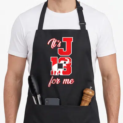 Amazigreek crew apron - Red and white It's J 13 for me text with elephant silhouette inside the number — shown on a black cotton canvas apron against a white background