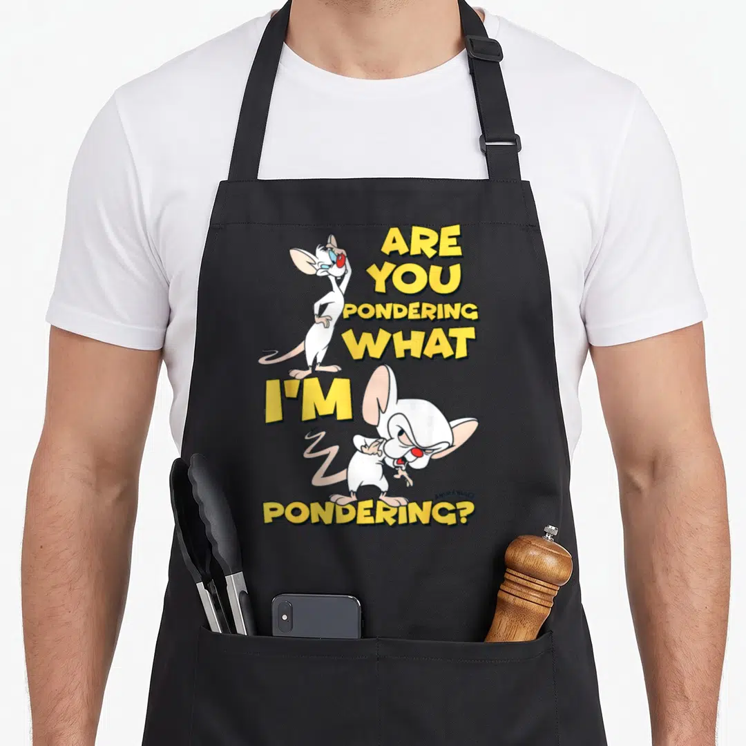 Pondering brain apron - Two white cartoon mice with Are You Pondering What I M Pondering yellow text — shown on a black cotton canvas apron against a white background