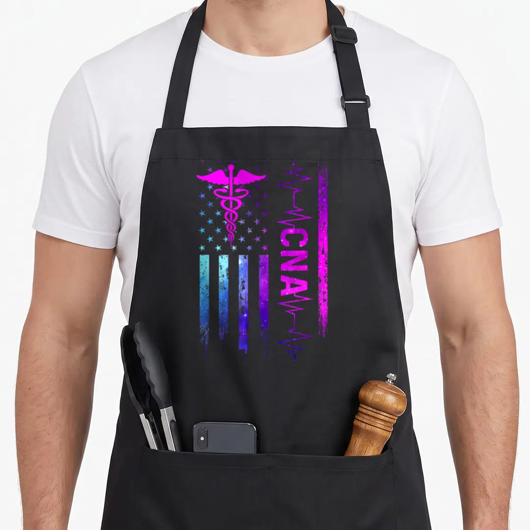 Cna nursing aprons - Distressed flag with pink caduceus, blue stripes, and vertical purple CNA text — shown on a black cotton canvas apron against a white background