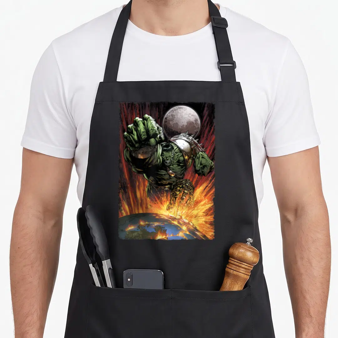 Comic war apron - Hulk punching Earth with fire explosions and moon background — shown on a black cotton canvas apron against a white background