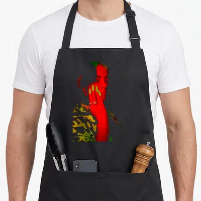 Billie eilish novelty apron - Stylized red photo of person face and hand with lime green nails and yellow accents — shown on a black cotton canvas apron against a white background