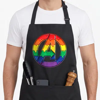 Funny rainbow drip apron - Circular A logo with dripping rainbow gradient in red orange yellow green blue purple — shown on a black cotton canvas apron against a white background