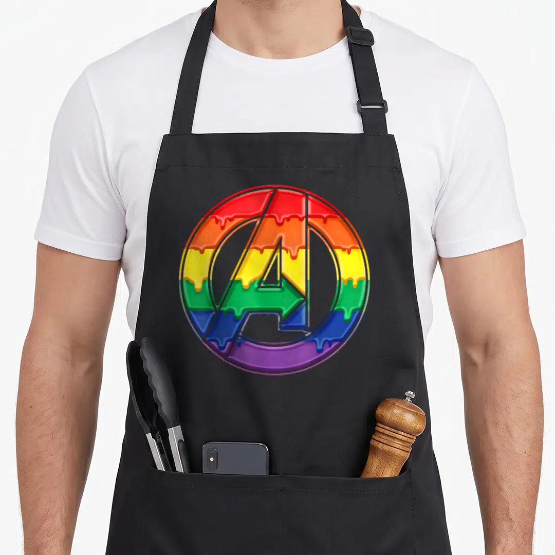 Funny rainbow drip apron - Circular A logo with dripping rainbow gradient in red orange yellow green blue purple — shown on a black cotton canvas apron against a white background