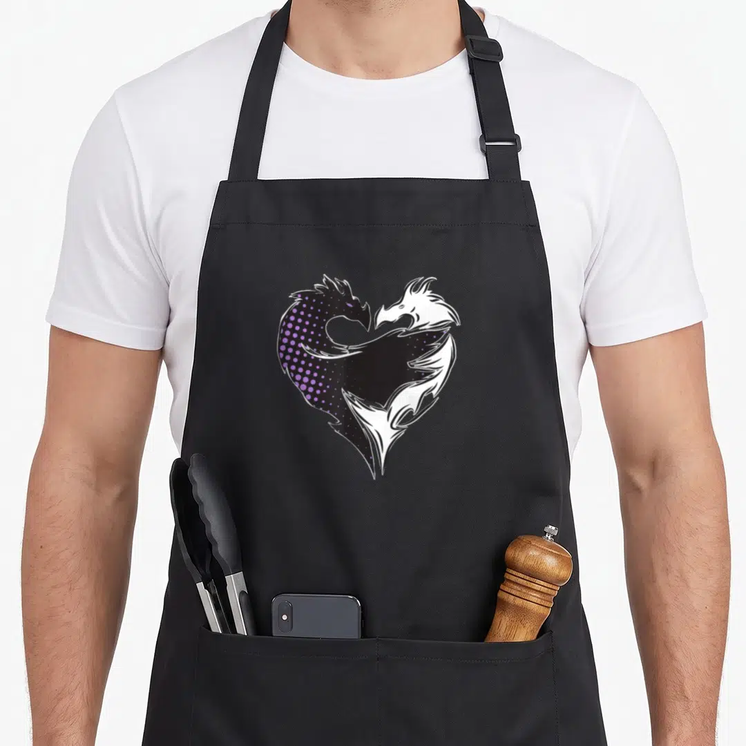 Mal dragon apron - Two mirrored purple and white dragons forming a heart shape on black background — shown on a black cotton canvas apron against a white background