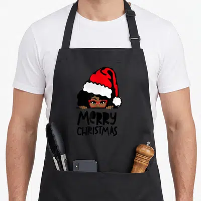 Melanin mrs apron - Woman in red Santa hat peeking over line above stacked Merry Christmas text in cartoon style — shown on a black cotton canvas apron against a white background