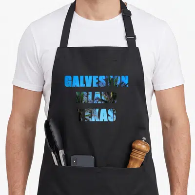 Galveston island texas apron - Stacked blue text GALVESTON ISLAND TEXAS with palm tree image fill — shown on a black cotton canvas apron against a white background