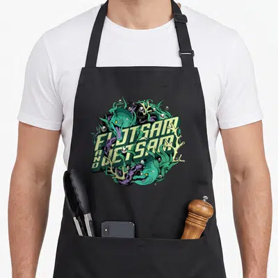Jetsam mermaid apron - Two green eels entwined around diagonal Flotsam and Jetsam text with purple tentacles and coral — shown on a black cotton canvas apron against a white background