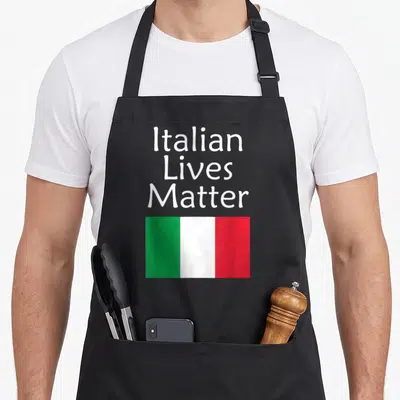 Live italian aprons - White Italian Lives Matter text above green white red flag rectangle — shown on a black cotton canvas apron against a white background