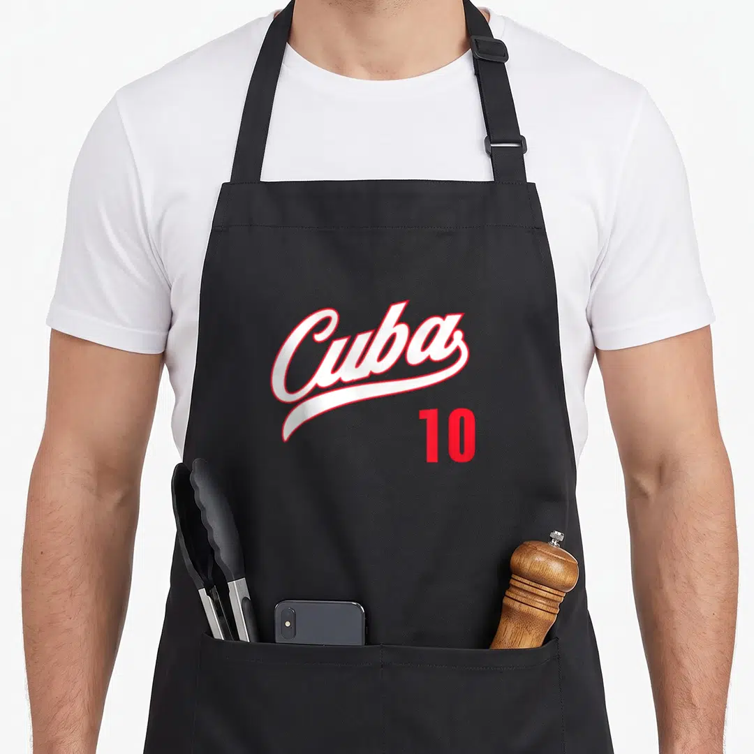 Cute cuba cuban apron - White script Cuba text with red outline and red number 10 below — shown on a black cotton canvas apron against a white background