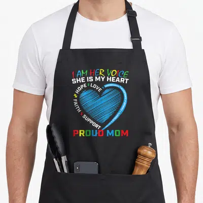 Blue mother daughter apron - Blue striped heart with I AM HER VOICE text and yellow puzzle piece — shown on a black cotton canvas apron against a white background