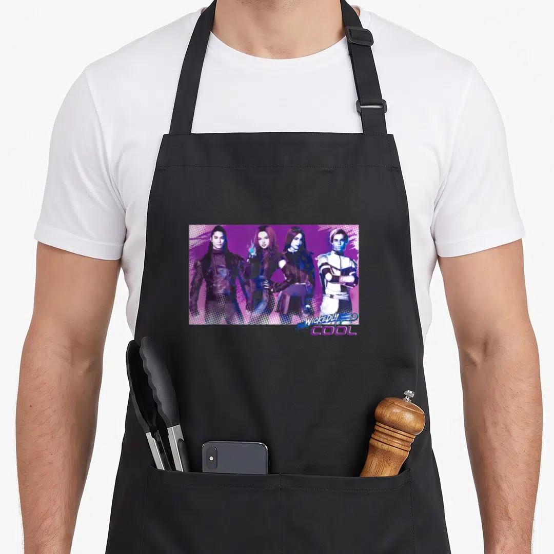Descendant jay apron - Four characters standing side-by-side on purple halftone background with WICKEDLY COOL text — shown on a black cotton canvas apron against a white background