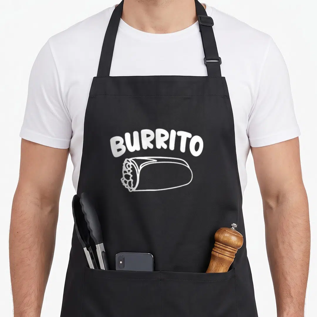 Burrito mexican apron - White arched text BURRITO above a line-drawing of a wrapped tortilla on black fabric — shown on a black cotton canvas apron against a white background