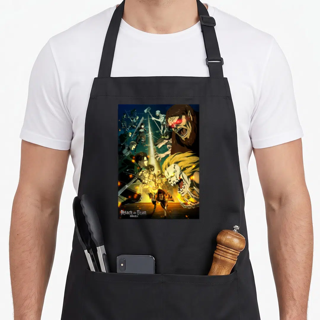 Final anime apron - Attack on Titan characters and titans in battle scene with brown yellow black white text — shown on a black cotton canvas apron against a white background