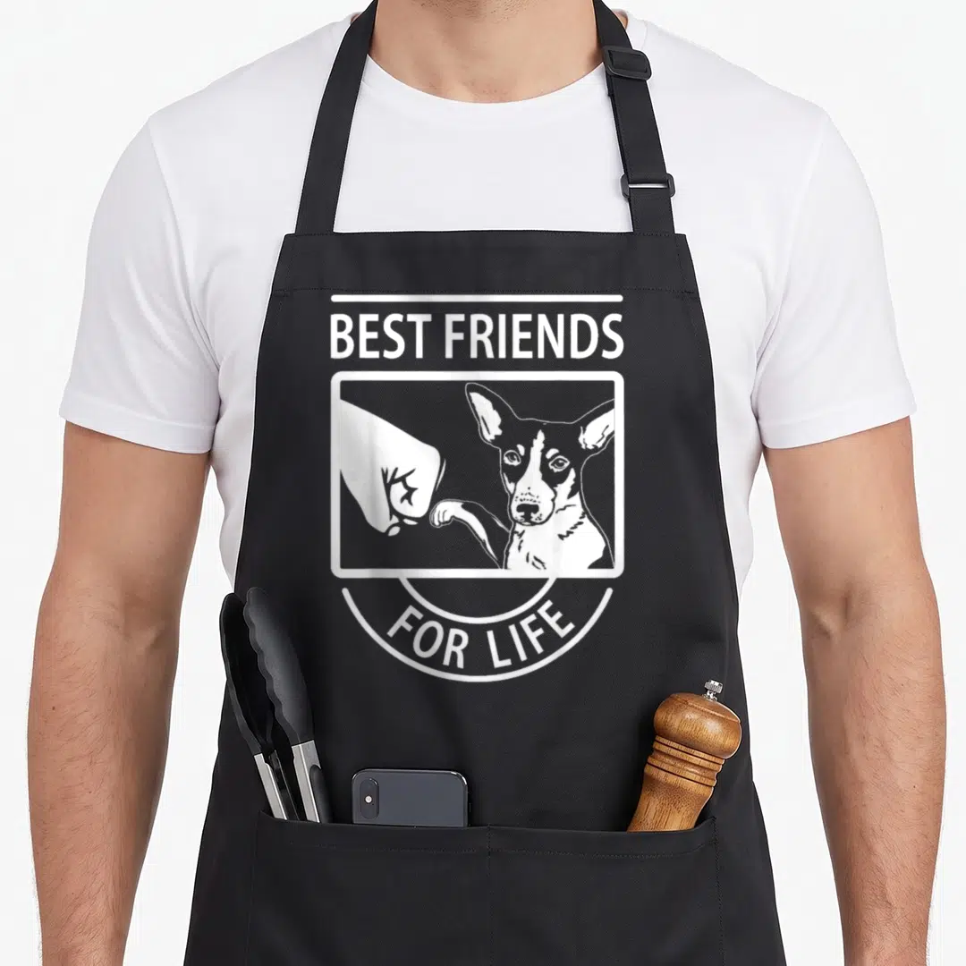 Rat friends apron - White line art of dog and hand touching paws with text Best Friends For Life — shown on a black cotton canvas apron against a white background