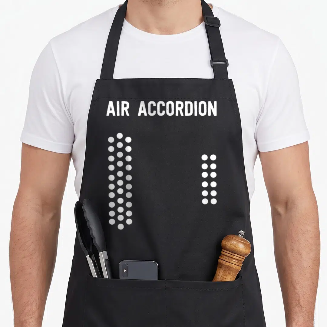 Vintage air accordion apron - White text AIR ACCORDION above two vertical columns of white dots — shown on a black cotton canvas apron against a white background