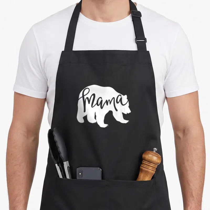 Momma mother's day aprons - White bear silhouette with grey Mama script text across center — shown on a black cotton canvas apron against a white background