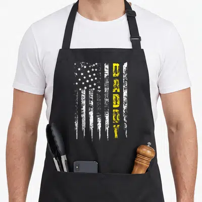 Line truck apron - Distressed white flag with vertical yellow DADDY lettering — shown on a black cotton canvas apron against a white background