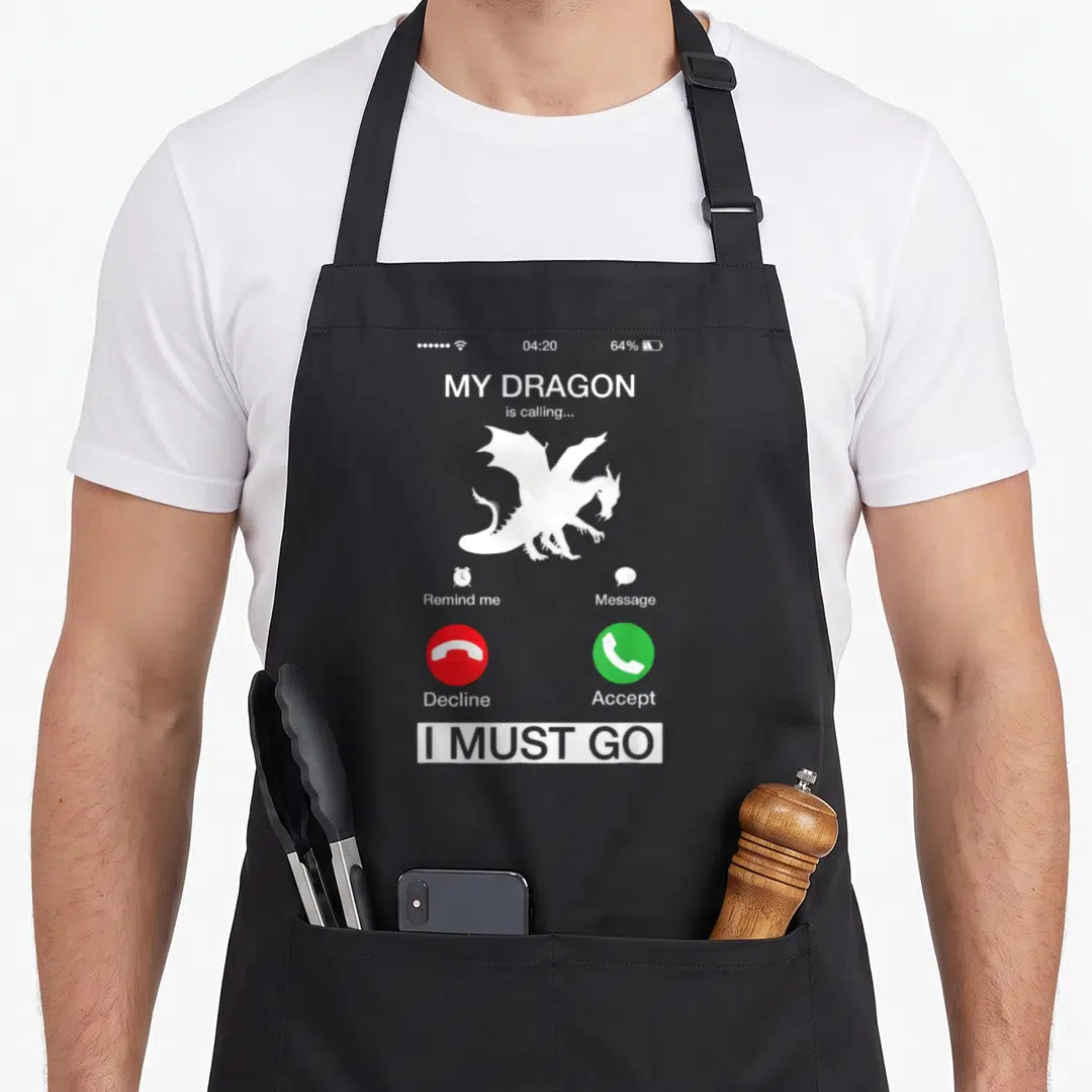 Calling dragon apron - Smartphone call screen with white dragon silhouette, red decline green accept buttons, and I — shown on a black cotton canvas apron against a white background