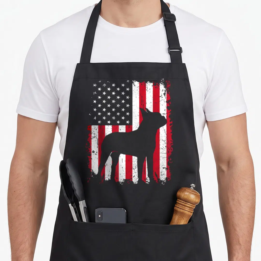Terrier 4th of july apron - Grey dog silhouette standing before a distressed red white and blue American flag pattern — shown on a black cotton canvas apron against a white background