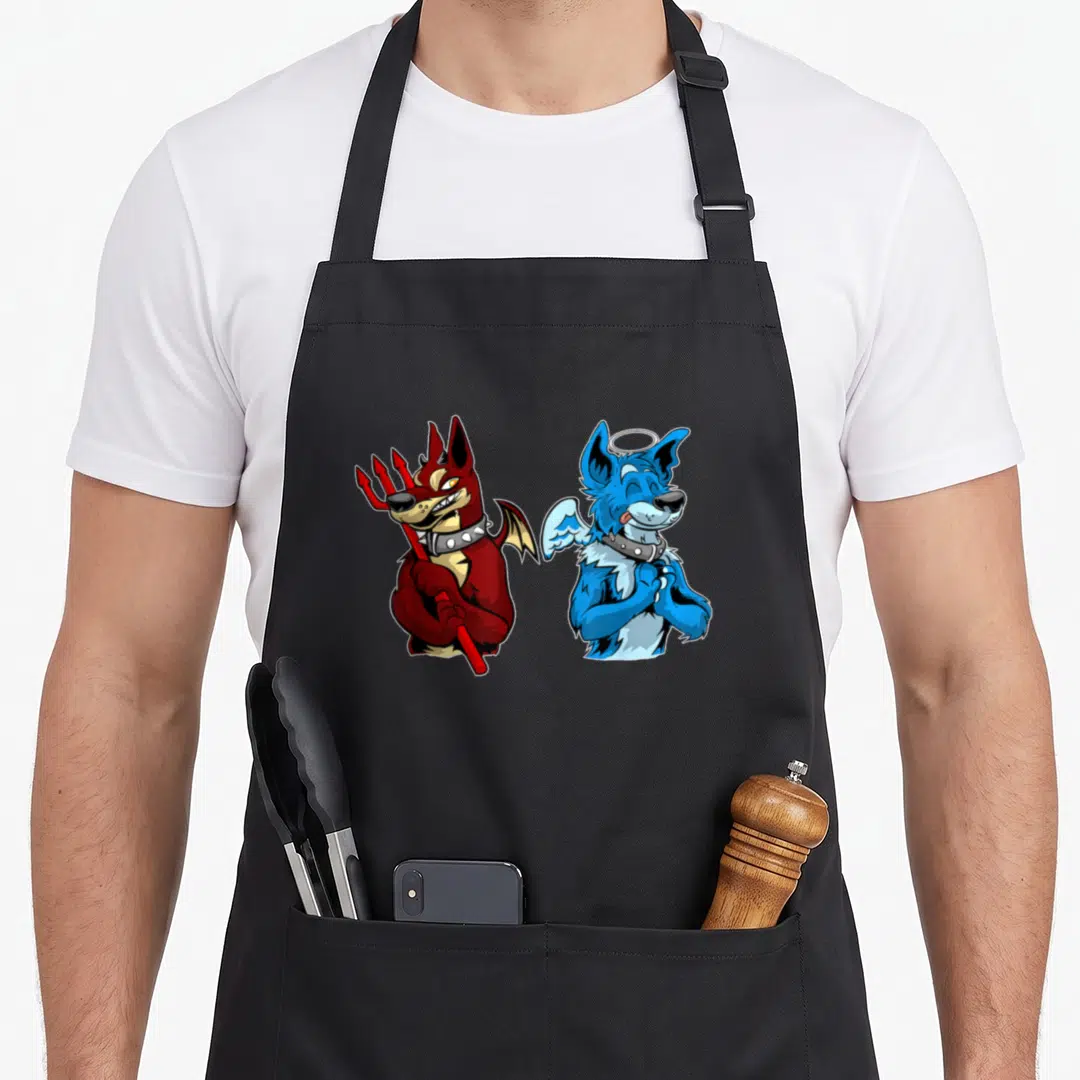 Furry dog apron - Red devil dog holding pitchfork faces blue angel dog with halo in cartoon style — shown on a black cotton canvas apron against a white background