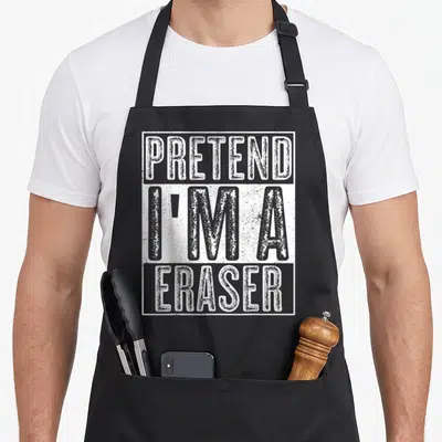 Pretend eraser costume halloween apron - Stacked distressed grey text reading PRETEND I'M A ERASER inside white border — shown on a black cotton canvas apron against a white background