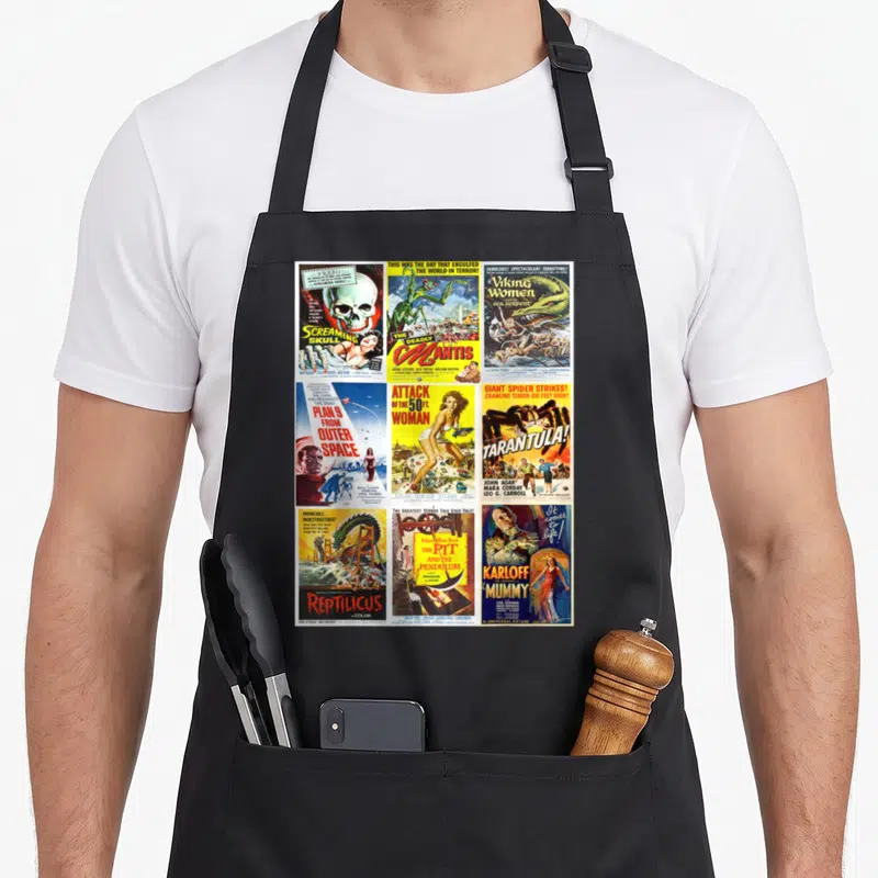 Collection horror movie apron - Six vintage B-movie posters arranged in a grid featuring monsters and retro typography — shown on a black cotton canvas apron against a white background