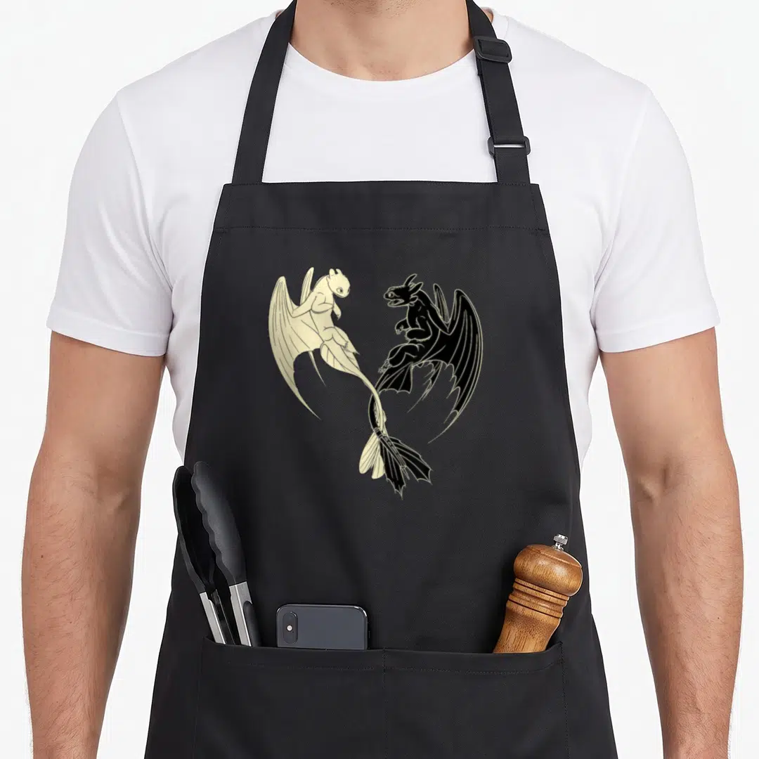 Lightfury train apron - Two dragons in yin-yang formation, black and cream minimalist art — shown on a black cotton canvas apron against a white background