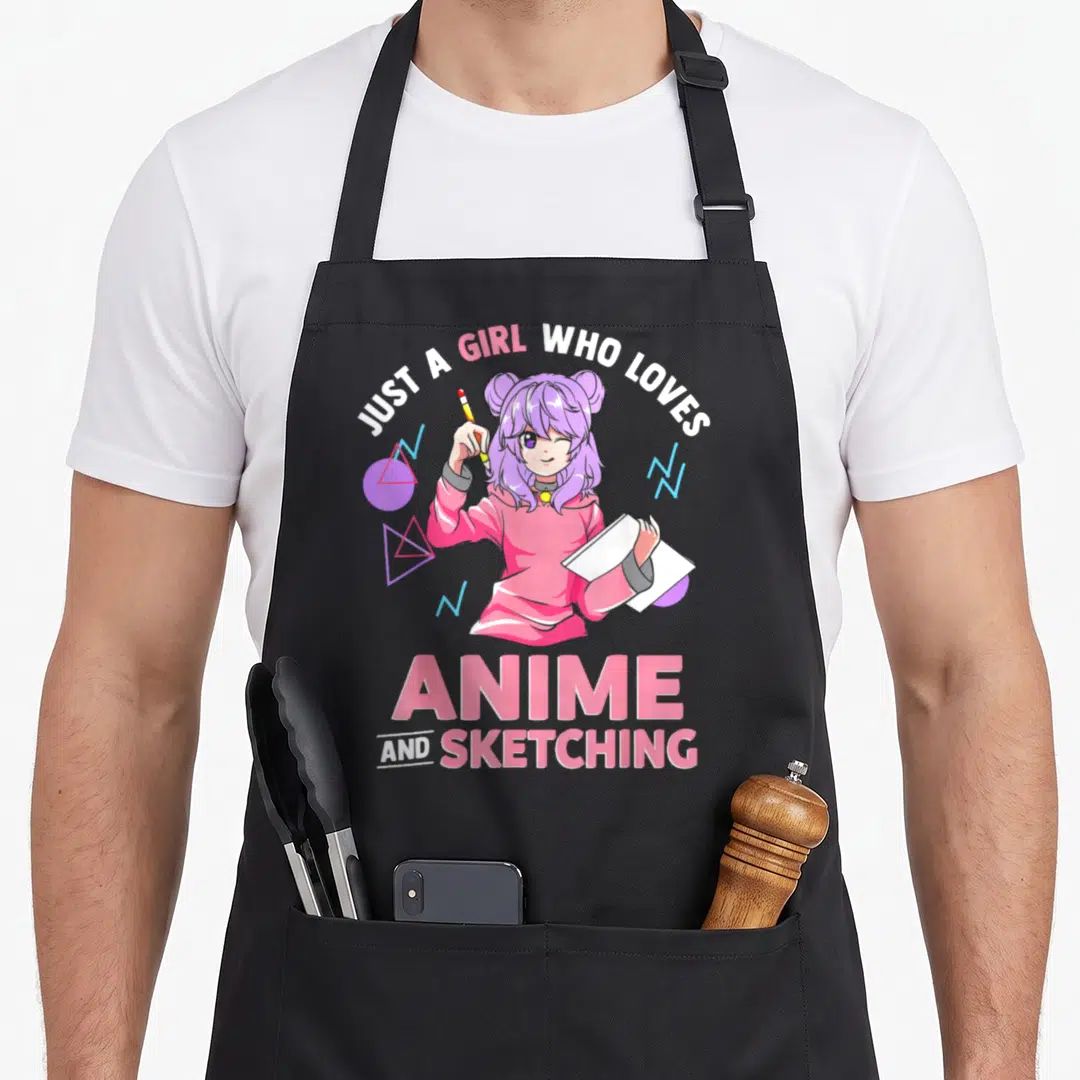 Funny sketching anime apron - Anime girl in pink hoodie holding pencil and sketchbook with geometric shapes — shown on a black cotton canvas apron against a white background