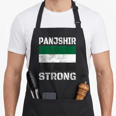Panjshir afghan apron - Distressed Panjshir flag with white green black stripes and strong text — shown on a black cotton canvas apron against a white background