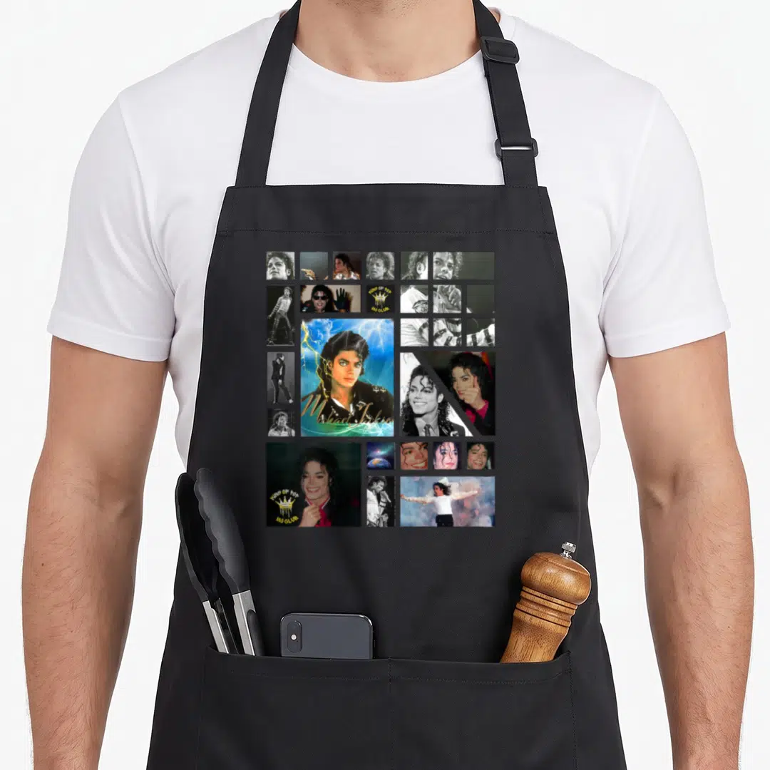 Funny jackson michaels apron - Collage of Michael Jackson photos with KING OF POP text and crown logo — shown on a black cotton canvas apron against a white background