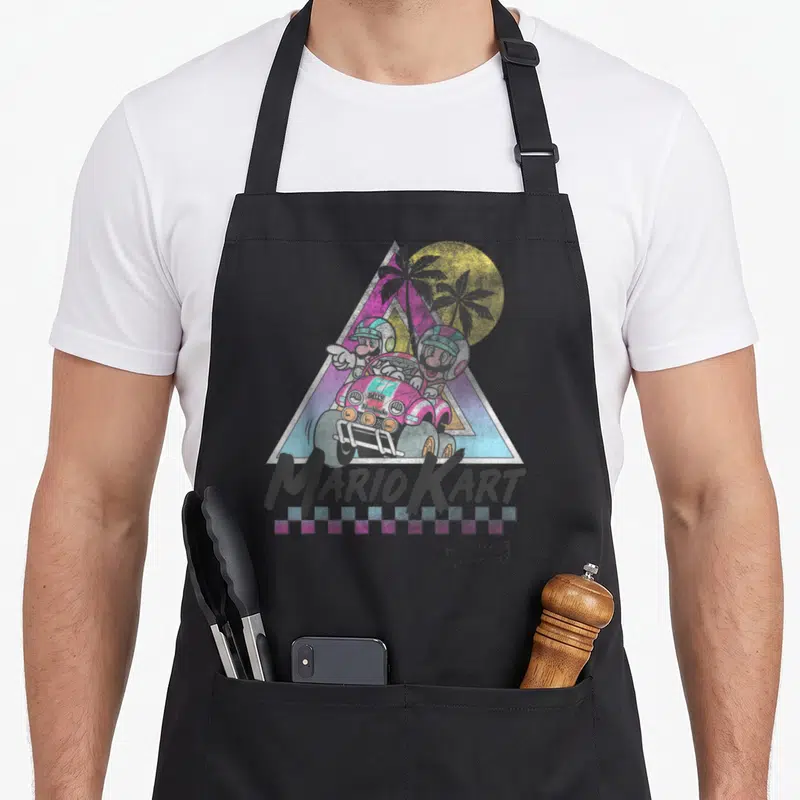 Trend novelty apron - Mario and Luigi in pink kart inside synthwave triangle with MARIO KART text and checkered border — shown on a black cotton canvas apron against a white background