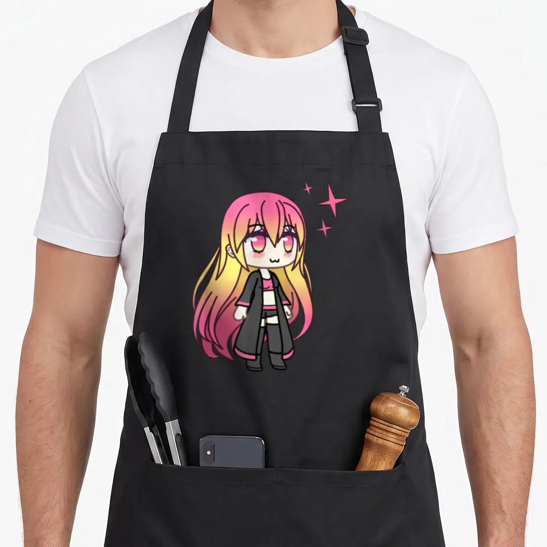 Zorya kawaii cooking apron - Chibi anime girl with pink yellow hair and three stars on black background — shown on a black cotton canvas apron against a white background