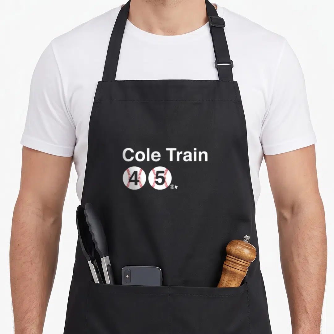 Gerrit new york apron - Cole Train text above two baseballs numbered 4 and 5 with red stitching — shown on a black cotton canvas apron against a white background