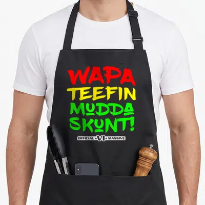 Wapa kitchen island apron - Stacked red yellow green distressed text reading WAPA TEEFIN MUDDA SKUNT! — shown on a black cotton canvas apron against a white background
