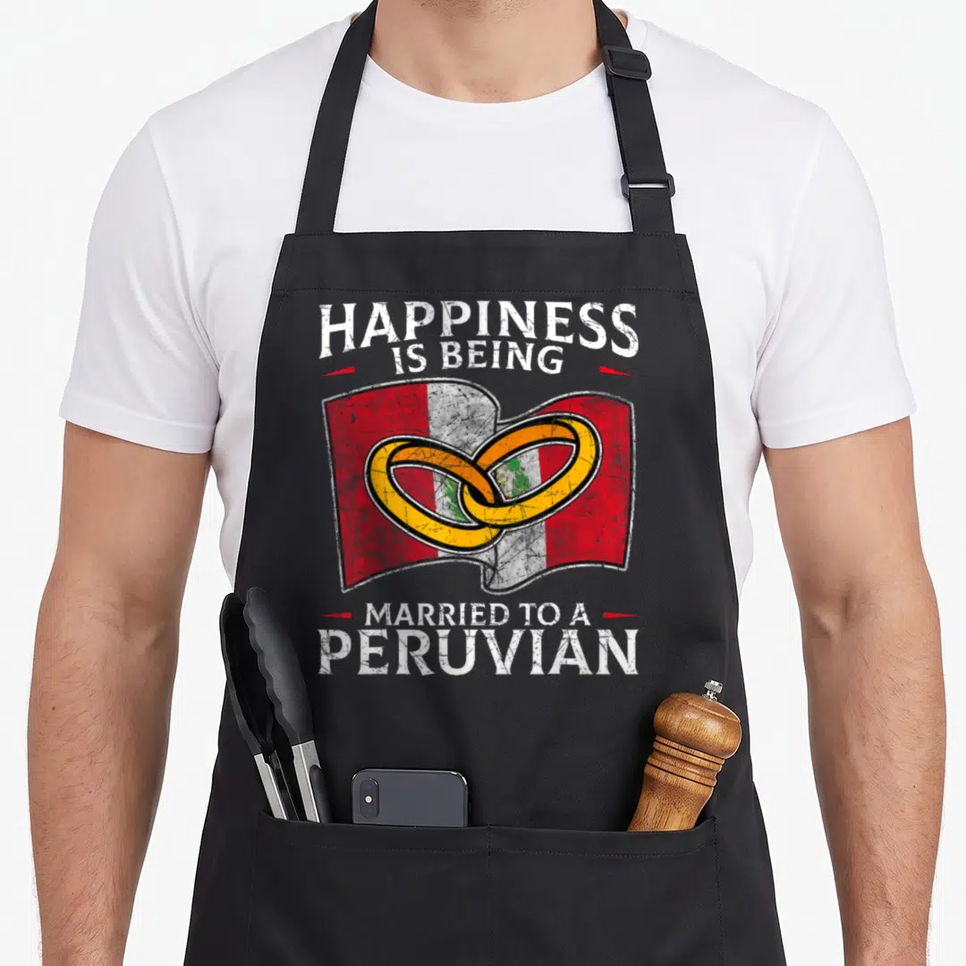 Peruvian wedding apron - Two interlocking gold rings over red white yellow flag with distressed text — shown on a black cotton canvas apron against a white background